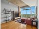 Bright living room with hardwood floors, city views, modern decor, and comfortable seating at 250 Pharr Ne Rd # 1812, Atlanta, GA 30305