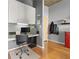 Functional office area with built-in desk, storage cabinets, and hardwood floors at 250 Pharr Ne Rd # 1812, Atlanta, GA 30305