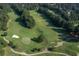 Scenic aerial shot of the golf course with lush fairways and greens, perfect for golfers of all skill levels at 7145 Hartsfield Pl, Suwanee, GA 30024