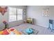 Bright and cheerful ' room with ample space for play and creative activities at 7145 Hartsfield Pl, Suwanee, GA 30024