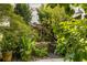 Picturesque backyard garden featuring a rock waterfall and vibrant plants at 834 Dekalb Ne Ave # D, Atlanta, GA 30307