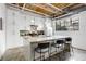 Modern kitchen with white cabinetry, granite countertops, a center island with bar seating, and a large window at 834 Dekalb Ne Ave # D, Atlanta, GA 30307