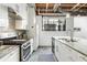 Well-appointed kitchen featuring stainless steel appliances, granite countertops, white cabinetry, and ample counter space at 834 Dekalb Ne Ave # D, Atlanta, GA 30307