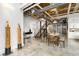 Open-concept living area featuring polished concrete floors, dining table, and staircase leading to the upper level at 834 Dekalb Ne Ave # D, Atlanta, GA 30307