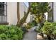 Charming path through lush greenery to the building entrance at 834 Dekalb Ne Ave # D, Atlanta, GA 30307