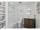 Modern bathroom featuring a glass-enclosed shower, patterned floor, and built-in shelves at 9 Market Square Nw Pl, Atlanta, GA 30318