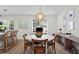 Bright dining area features a round table with seating for four, and modern light fixture at 9 Market Square Nw Pl, Atlanta, GA 30318