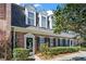 Charming brick townhome with well-maintained landscaping and traditional architectural details at 9 Market Square Nw Pl, Atlanta, GA 30318