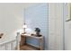 Hallway featuring accent wall, console table, and neutral decor at 9 Market Square Nw Pl, Atlanta, GA 30318