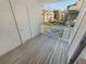 Enjoy the view from this cozy balcony with wooden floors and painted white railings at 1250 Parkwood Se Cir # 2309, Atlanta, GA 30339
