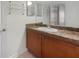 Bathroom vanity featuring traditional wood cabinetry, and neutral countertop at 1250 Parkwood Se Cir # 2309, Atlanta, GA 30339