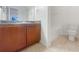 Bathroom with vanity featuring wood cabinets and a tile floor at 1250 Parkwood Se Cir # 2309, Atlanta, GA 30339