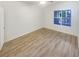 Bright, airy bedroom with ample natural light and stylish laminate wood flooring at 1250 Parkwood Se Cir # 2309, Atlanta, GA 30339
