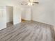 Bright bedroom with neutral walls, ceiling fan, and durable gray wood-look floors at 1250 Parkwood Se Cir # 2309, Atlanta, GA 30339
