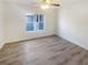 Comfortable bedroom with modern ceiling fan, natural light and durable gray wood-look floors at 1250 Parkwood Se Cir # 2309, Atlanta, GA 30339