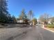 Community entrance with manicured landscaping and a secure gated entry at 1250 Parkwood Se Cir # 2309, Atlanta, GA 30339