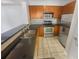 Well-lit kitchen with stainless steel appliances, granite countertops, and ample storage at 1250 Parkwood Se Cir # 2309, Atlanta, GA 30339