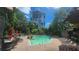 Inviting community pool with lounge chairs, lush landscaping, and views of a high-rise at 1250 Parkwood Se Cir # 2309, Atlanta, GA 30339