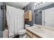 Cozy bathroom with gray walls, shower with curtains, and a vanity with a mirror at 2161 Peachtree Ne Rd # 508, Atlanta, GA 30309