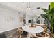 Modern dining area with a round table, stylish chairs, and a mirrored wall feature at 2161 Peachtree Ne Rd # 508, Atlanta, GA 30309