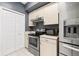 Contemporary kitchen features stainless steel appliances and modern cabinetry for sleek design at 2161 Peachtree Ne Rd # 508, Atlanta, GA 30309