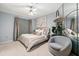 Bright main bedroom with a cozy chair, stylish decor, and abundant natural light at 2161 Peachtree Ne Rd # 508, Atlanta, GA 30309