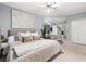 Comfortable main bedroom featuring neutral tones, a large bed, and mirrored wall accents at 2161 Peachtree Ne Rd # 508, Atlanta, GA 30309