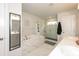 Spa-like bathroom with a soaking tub, tiled shower, double vanity, and luxurious finishes at 456 Millsap Way, Marietta, GA 30060