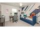 Well-lit bedroom featuring a daybed, a desk, and stylish blue and white accent wall at 456 Millsap Way, Marietta, GA 30060