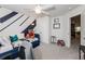 Bright bedroom featuring a daybed, neutral carpet, and a fun accent wall at 456 Millsap Way, Marietta, GA 30060
