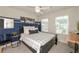 Stylish bedroom featuring a modern color scheme, a large bed, and bright natural light at 456 Millsap Way, Marietta, GA 30060