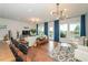 Bright open-concept living space featuring hardwood floors, large windows, and stylish decor at 456 Millsap Way, Marietta, GA 30060