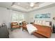 Serene bedroom with tray ceilings, plush carpet, large windows, and stylish decor at 456 Millsap Way, Marietta, GA 30060