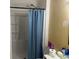 Clean bathroom featuring a stand up shower with blue shower curtain at 4574 Cedar Ridge Trl, Stone Mountain, GA 30083
