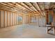 Unfinished basement featuring exposed framing and utilities, offering a blank canvas for customization at 514 Eagles Pt, Fairburn, GA 30213