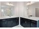 Elegant bathroom featuring double vanities with sleek countertops and stylish fixtures at 514 Eagles Pt, Fairburn, GA 30213