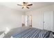 Bedroom with neutral carpet and walls and a bed with a blue patterned comforter at 514 Eagles Pt, Fairburn, GA 30213