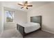 Neutral bedroom features a cozy bed and a window with natural light at 514 Eagles Pt, Fairburn, GA 30213