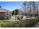 Outdoor community seating area with chairs, tables, and sun umbrellas at 514 Eagles Pt, Fairburn, GA 30213
