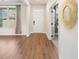 Inviting foyer with hardwood floors, elegant mirror, and natural light at 514 Eagles Pt, Fairburn, GA 30213