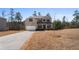 Beautiful two-story home with landscaped yard, showcasing the well-maintained exterior at 514 Eagles Pt, Fairburn, GA 30213