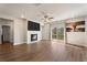 Comfortable living room with fireplace, modern decor, and access to outdoor space at 514 Eagles Pt, Fairburn, GA 30213