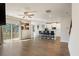 Open-concept living area flows to a balcony, featuring hardwood floors and bar seating at 514 Eagles Pt, Fairburn, GA 30213