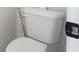 Close-up of a white toilet with a silver bidet attachment at 514 Eagles Pt, Fairburn, GA 30213