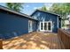 A large, wooden back deck with blue siding and double doors at 1052 Donnelly Sw Ave, Atlanta, GA 30310