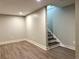 Finished basement area with durable flooring and easy access to the stairs at 1052 Donnelly Sw Ave, Atlanta, GA 30310