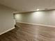 Spacious finished basement with luxury vinyl plank flooring and neutral paint at 1052 Donnelly Sw Ave, Atlanta, GA 30310