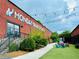 Beautiful outside view of Monday Night Garage brewery with string lights and green space at 1052 Donnelly Sw Ave, Atlanta, GA 30310