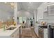 Bright kitchen with stainless appliances and modern fixtures overlooking the dining room at 1052 Donnelly Sw Ave, Atlanta, GA 30310