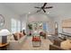 Bright living room features vaulted ceiling, hardwood floors, stylish decor, and French doors to the deck at 1052 Donnelly Sw Ave, Atlanta, GA 30310